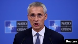FILE - NATO Secretary General Jens Stoltenberg speaks during a news conference at the alliance's headquarters in Brussels, Belgium, Oct. 20, 2021. 