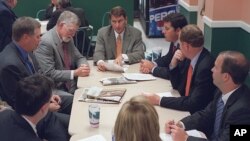 FILE - Lobbyist Brian Ballard, center meets with other lobbyists. Ballard has collected more than $2.3 million in lobbying fees this year.