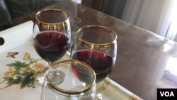 Wine glasses are seen filled with "21 Rays," a red wine made in Iraqi Kurdistan. The wine's producer, "Nabaz," hopes to one day export it to the world market. (S. Behn/VOA)