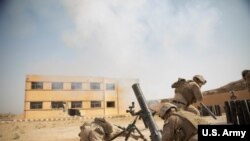 Syria --U.S. Marines fire an M120 Mortar round at a known ISIS target in the Middle Euphrates River Valley Deir ez-Zor province, Syria, Oct. 4, 2018. The coalition forces continue to assist in Operation Roundup, the Syrian Democratic Forces led ground offensive against the Islamid State. (U.S. Army photo by Sgt. Matthew Crane)