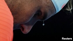 A bead of sweat drips from Spain's Rafael Nadal during his second round match against Michael Mmoh of the U.S., February 11, 2021. (REUTERS/Loren Elliott)