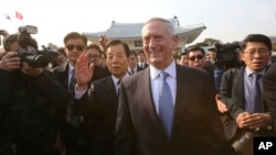 U.S. Defense Secretary Jim Mattis (center right) walks with South Korean Defense Minister Han Min Koo (center left) to meet Korean War veterans at the National Cemetery in Seoul, South Korea, Feb. 3, 2017.