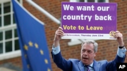 FILE - Nigel Farage, a British politician and leader of the UKIP party, holds up a placard as he launches his party's campaign for Britain to leave the European Union, outside the EU representative office in London, May, 20, 2016.