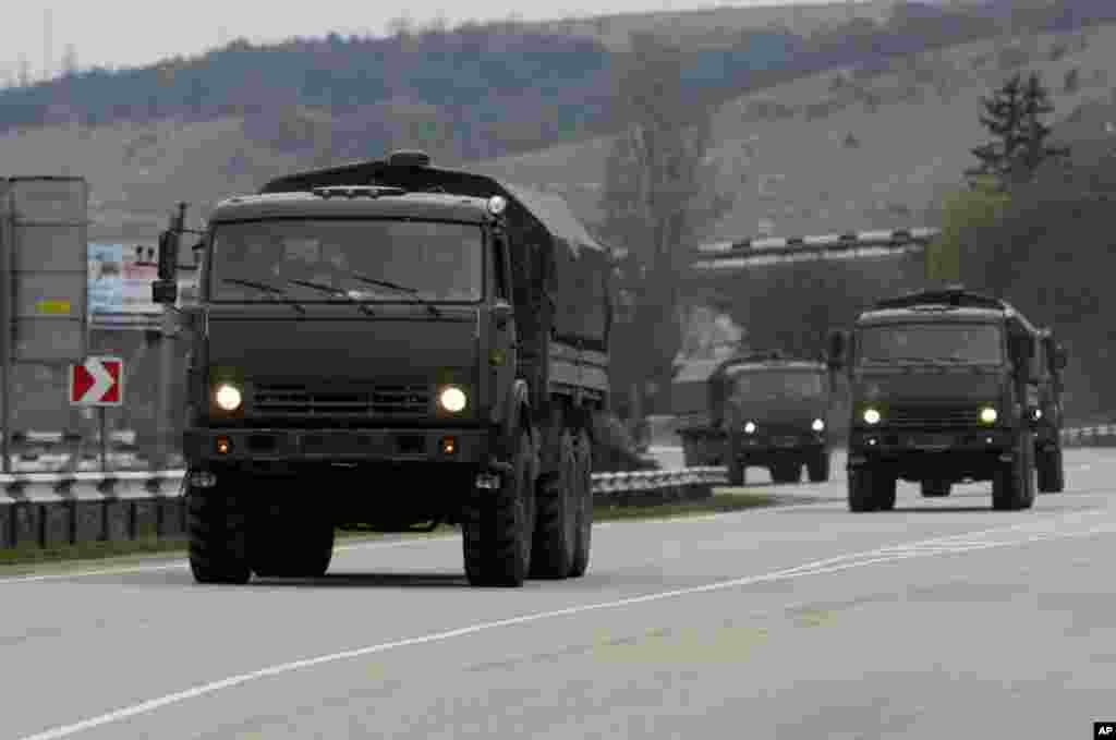 A convoy of hundreds of Russian troops headed toward the regional capital of Ukraine&#39;s Crimea region, a day after Russia&#39;s forces took over the strategic Black Sea peninsula without firing a shot. Pictured here, a Russian convoy moves from Sevastopol to Sinferopol in the Crimea, Ukraine, March 2, 2014.&nbsp; 