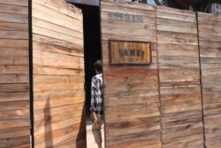 A man enters Samai Distillery in Phnom Penh, Cambodia, March 31, 2020. (Phorn Bopha /VOA Khmer)