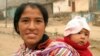 Sensitive care provides lasting benefits to youngsters, research shows. Here, a Peruvian mother carries her baby in the hills above Lima. (Photo courtesy of Ian Riley / Wikipedia Commons)