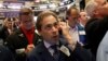 Traders work on the floor of the New York Stock Exchange in New York City, July 15, 2016.