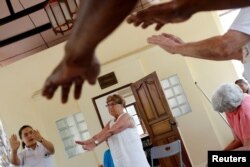 A group of retired foreigners attend a Tai Chi class, while staying at the Care Resort in Chiang Mai, Thailand April 6, 2018.