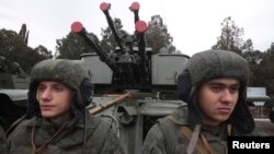 FILE - Russian marines take part in a military parade during celebrations marking the forces' annual holiday in the Crimean port of Sevastopol, Nov. 29, 2014.