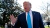 President Donald Trump speaks to members of the media on the South Lawn of the White House in Washington, before boarding Marine One helicopter, April 10, 2019.