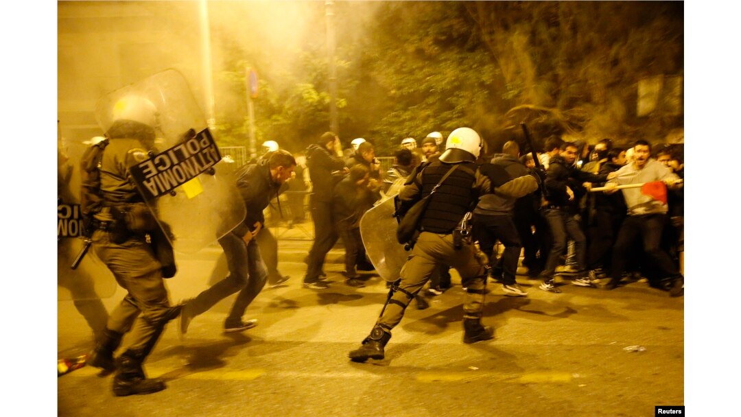 Riot policemen clash with protesters at a rally marking the 41st anniversary of a 1973 student uprising against a U.S. backed military dictatorship in then ruling Greece, near the U.S. embassy in Athens, Nov. 17, 2014.