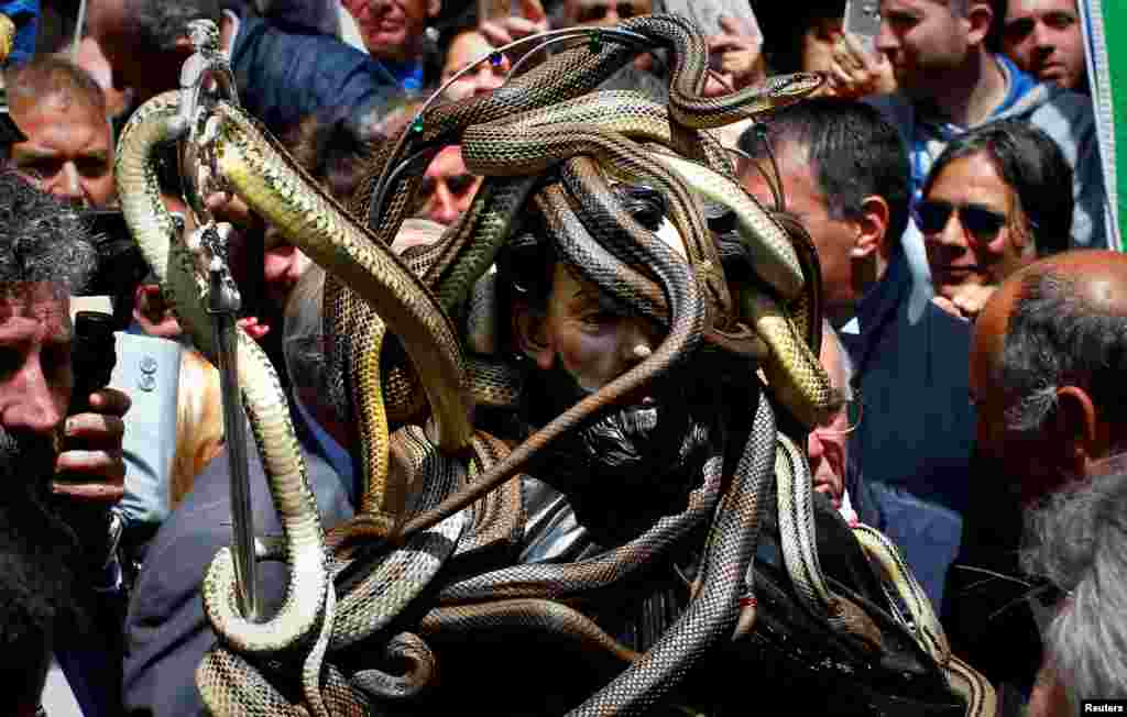 Snakes cover a wooden statue of Saint Domenico during a procession in Cocullo, central Italy, May 1, 2017.