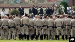 Family members carrying the casket of Yvette Velasco, a victim of the San Bernardino shootings this month, arrive at a memorial service in Covina, Calif., Dec. 10, 2015.