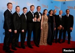 FILE - The cast and producers of the TV drama series "Homeland," pose together backstage after "Homeland" won the award for Best Drama Series at the 70th annual Golden Globe Awards in Beverly Hills, California, Jan. 13, 2013.