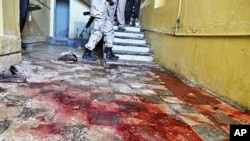 Stains of blood cover a hallway inside the Hotel Muna in Mogadishu, 24 Aug 2010