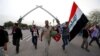 Followers of Iraqi Shi'ite cleric Moqtada al-Sadr leave the heavily secured Green (International) Zone in Baghdad, Iraq, May 1, 2016. For weeks, they have been protesting government corruption, political patronage and inefficiency.