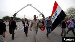 Followers of Iraqi Shi'ite cleric Moqtada al-Sadr leave the heavily secured Green (International) Zone in Baghdad, Iraq, May 1, 2016. For weeks, they have been protesting government corruption, political patronage and inefficiency.