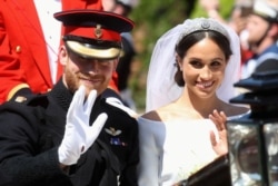 Prince Harry, Duke of Sussex and Meghan, Duchess of Sussex leave Windsor Castle in the Ascot Landau carriage during a procession after getting married at St Georges Chapel on May 19, 2018 in Windsor, England.