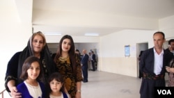 Payman Salih, her daughters and her husband, Sanger Abuzaid, say they hope the vote will signify an abrupt change in government policies impacting their region on May 12, 2018 in Irbil, Kurdistan Region, Iraq. (H.Murdock/VOA)