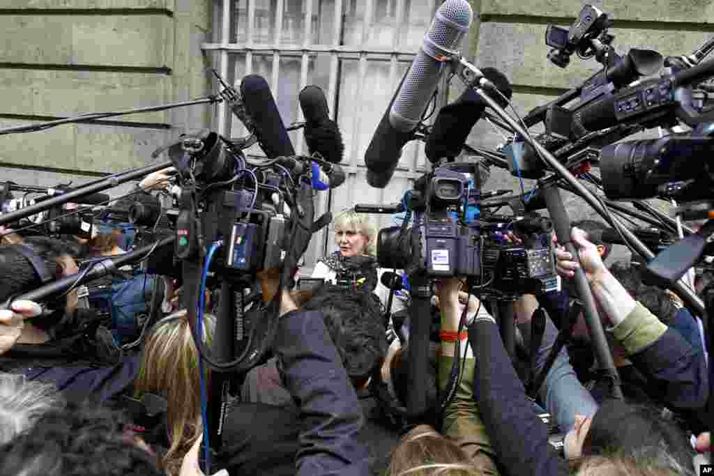 French UMP conservative party member and former minister Nadine Morano, center, addresses reporters outside the French National Assembly in Paris. The leader of former French President Nicolas Sarkozy&#39;s conservative party is resigning amid a scandal over financing of Sarkozy&#39;s losing 2012 presidential campaign.