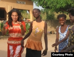 Teacher and Starling Sponsorship Program founder Ashleigh DeLuca (left) with students in 2008. (Courtesy photo)