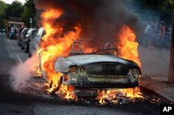 A car burns during a protest against the upcoming G-20 summit in Hamburg, Germany, July 6, 2017.