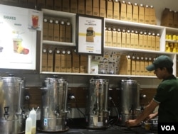 Disposable flasks stacked up to deliver tea to homes and offices. (A. Pasricha/VOA)