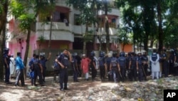 Bangladeshi policemen arrive near the scene of a blast in Kishoreganj, about 90 kilometers (60 miles) north of the capital of Dhaka, Bangladesh, July 7, 2016.