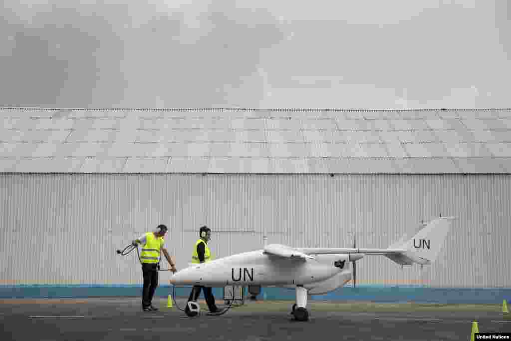 A team of technicians prepare for the launch of a UN drone during an official ceremony, Goma, DRC, Dec. 3, 2013.
