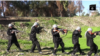 Chilren are seen carrying weapons and performing military drills in this still from an IS video called 'Blood of Jihad 2.'