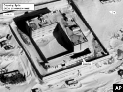 This image provided by the State Department and DigitalGlobe, taken Jan. 15, 2015, a satellite image of what the State Department described as a building in a prison complex in Syria that was modified to support a crematorium.