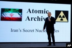 Israeli Prime Minister Benjamin Netanyahu presents material on Iranian nuclear weapons development during a press conference in Tel Aviv, April 30 2018.