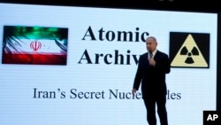 FILE - Israeli Prime Minister Benjamin Netanyahu presents material on Iranian nuclear weapons development during a press conference in Tel Aviv, April 30 2018.