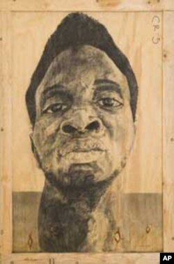 A self-portrait of Serge Alain Nitegeka, in charcoal
