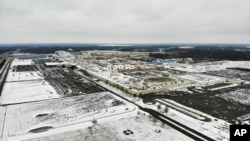 FILE - Snow covers the perimeter of the General Motors' Lordstown plant, in Lordstown, Ohio, Nov. 28, 2018. 