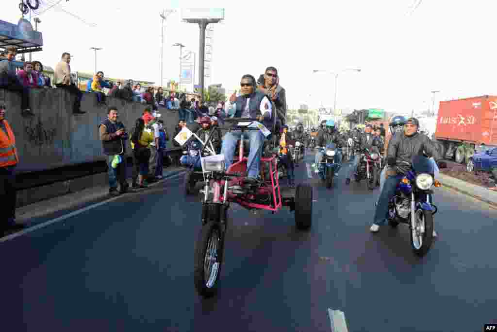 Bikers take part in the &quot;Caravana del Zorro&quot; (Caravan of the Fox), from Constitution Square in Guatemala City to Esquipulas, 220 km eastward. Some 35,000 motorcyclists marched in a pilgrimage to the Cristo Negro (Black Christ) Basilica, a 53-year-old tradition that was declared a Nation Heritage event.