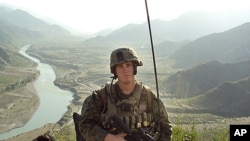 In this undated photo released by the U.S. Marines, Sergeant Dakota Meyer poses for a photo while deployed in support of Operation Enduring Freedom in Ganjgal Village, Kunar province, Afghanistan.