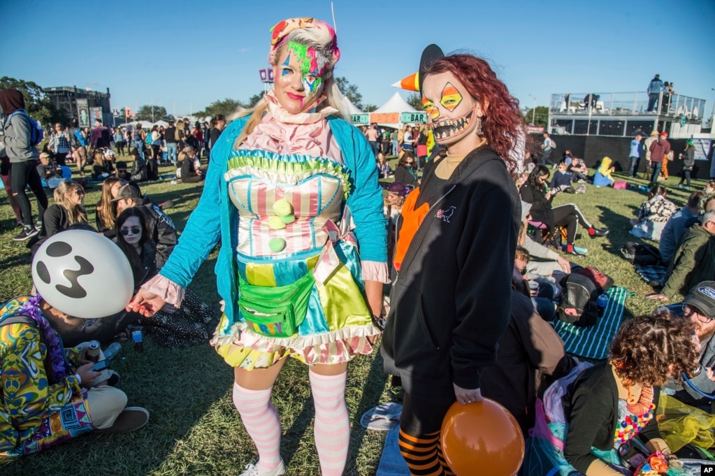 Festival goers in Halloween costumes attend the Voodoo Music Experience in City Park on Oct. 28, 2017, in New Orleans.