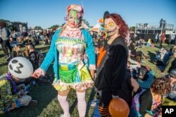 Festival goers in Halloween costumes attend the Voodoo Music Experience in City Park on Oct. 28, 2017, in New Orleans.