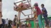 Children enjoy a manual Ferris wheel ride during the Eid Al-Adha religious celebration at the Kutipalong refugee camp in Cox's Bazar this week.