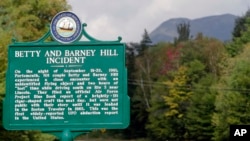 FILE - A state marker is pictured in Franconia Notch, N.H., Sept. 14, 2011, noting the story where, 50 years earlier, Betty and Barney Hill reported seeing a large, flying disc-shaped object, and eventually said through hypnosis that they had been abducted by extraterrestrials.
