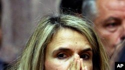 Parliament member Milena Apostolaki reacts during the speech of Greek Prime Minister George Papandreou to the Socialist members of parliament in Athens, October 31, 2011.