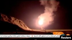 A still image taken from footage shot on June 18, 2017 and broadcast on Iranian Television IRINN, purports to show missiles being fired from Iran into eastern Syria.