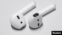Apple AirPods are displayed during a media event in San Francisco, California