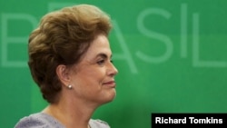 Brazil's President Dilma Rousseff smiles as she attends a meeting with jurists at Planalto Palace in Brasilia, Brazil, March 22, 2016. 