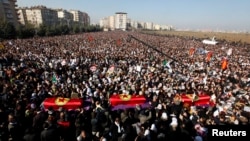 Thousands attend the funeral ceremony of the three Kurdish activists shot in Paris, in Diyarbakir, Turkey, January 17, 2013. 