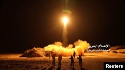 A photo distributed by the Houthi Military Media Unit shows the launch by Houthi forces of a ballistic missile aimed at Saudi Arabia March 25, 2018. 