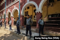 Police guard the courtroom in Yangon’s Insein Township where reporters Wa Lone and Kyaw Soe Oo are on trial.