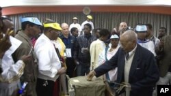 Election officials close the last ballot box at a polling station in Addis Ababa's historic district at the end of voting day, 23 May 2010