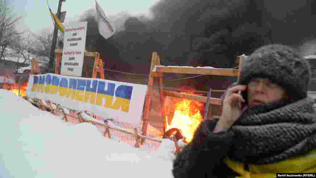 Riot police remove a tent camp set up last October by supporters of Mikheil Saakashvili, who are demanding President Petro Poroshenko resign, detaining over 100 people, in Kyiv, Ukraine, March 3, 2018.